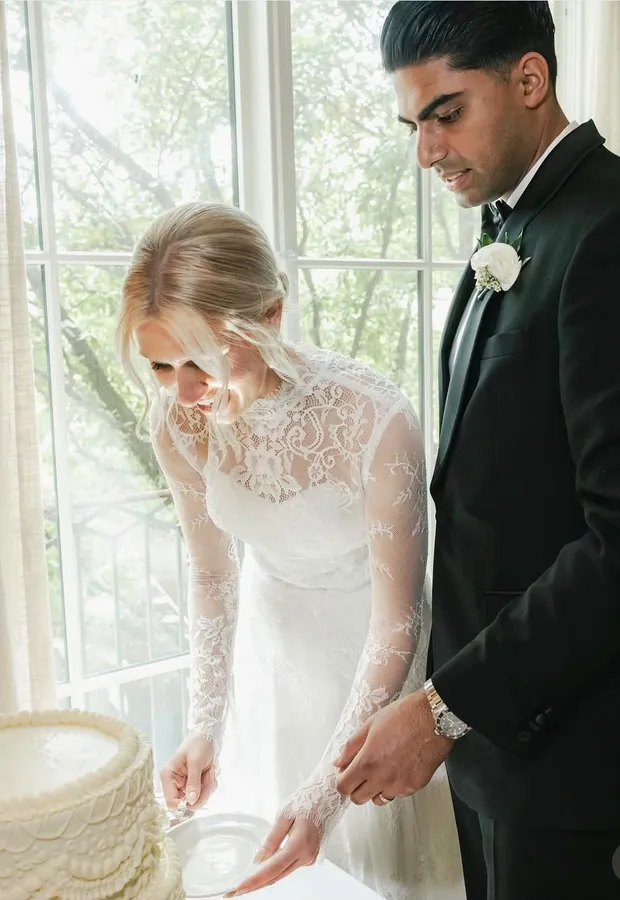 Newlyweds cutting their wedding cake