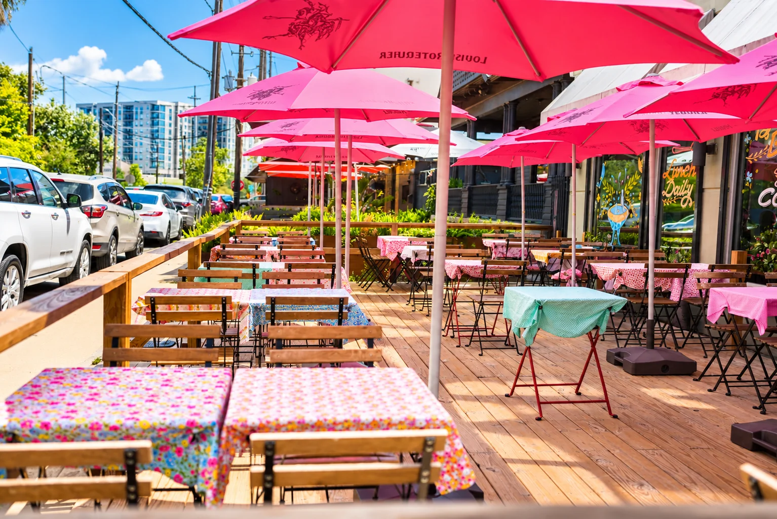Pink umbrellas and colorful tables on Cucharita’s patio