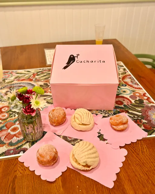A pink Cucharita box and conchas at the anniversary party